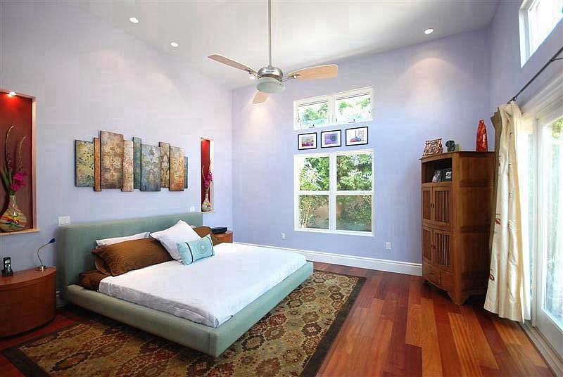 Custom Principal Bathroom with high ceiling, custom fixtures, decorative nooks and direct access to patio.