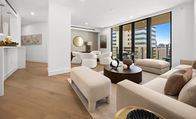 Sky Residence D living room with Restoration Hardware furnishings and stunning balcony views.