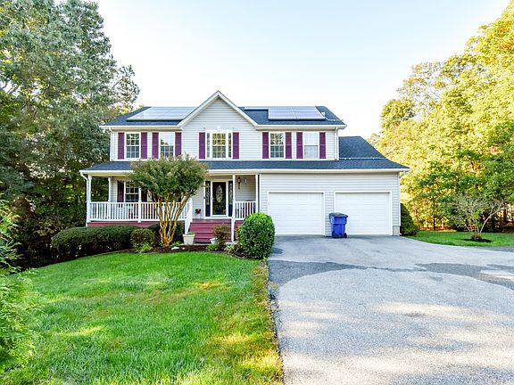 Paved Driveway Leading to Oversized Garage