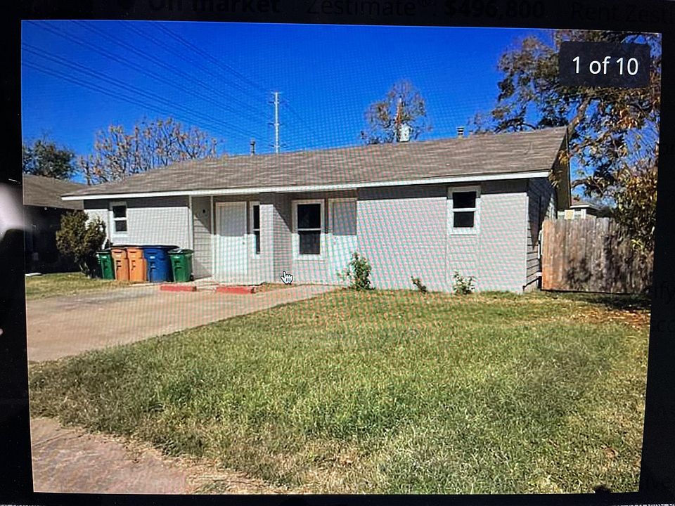 Front yard--Parking spot. older pic, as now there is a tree on each side.