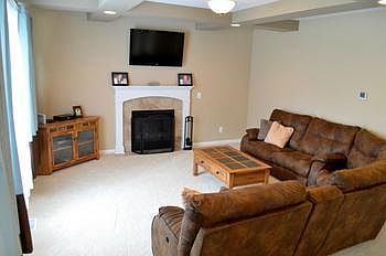 Another living room view from the dining area.  Notice there are almost no nail holes on the walls.  Everything is still like new!