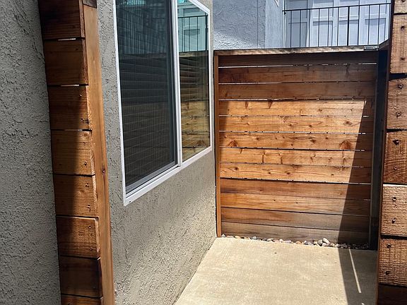 Small private patio at front door, perfect for potted plants and morning coffee