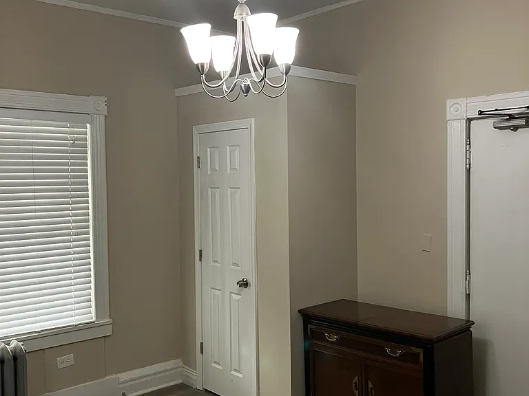 Large, fully furnished first bedroom that can serve as an office or den.