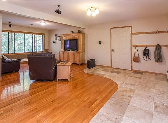 To the right inside the front door you will look towards the main level living room. Notice the tile
