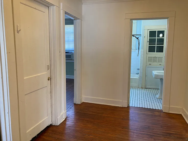 Hallway looking into bathroom and bedroom #2