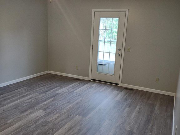 Main level living area with door to patio area