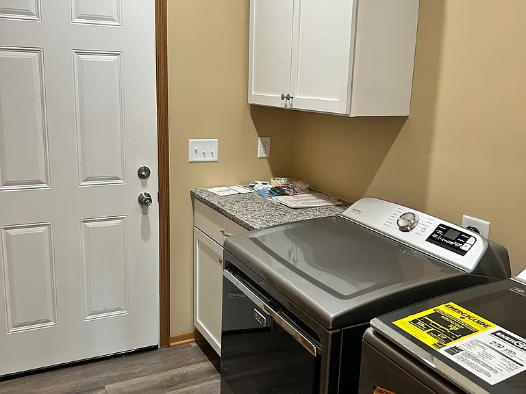 Laundry room and door to the garage (washer/dryer not included)