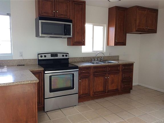 Spacious Kitchen with stainless Steel Stove and Microwave