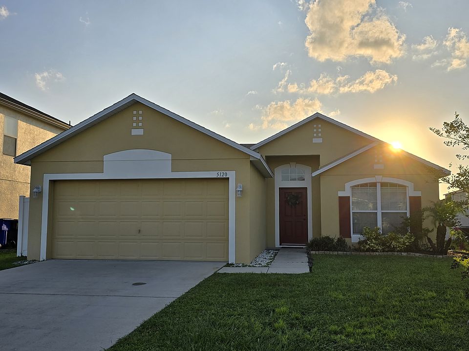 Front exterior of property, two-car garage.