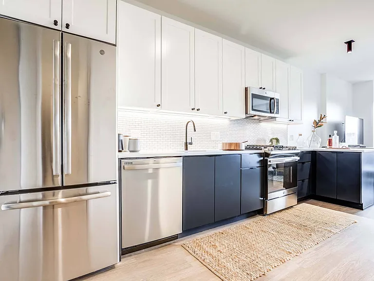 Prepare meals in a kitchen that combines modern design with practical functionality.