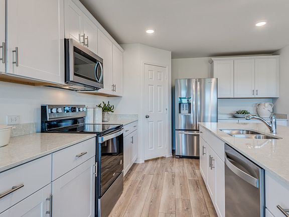 Abundant cabinet space in kitchen model representation