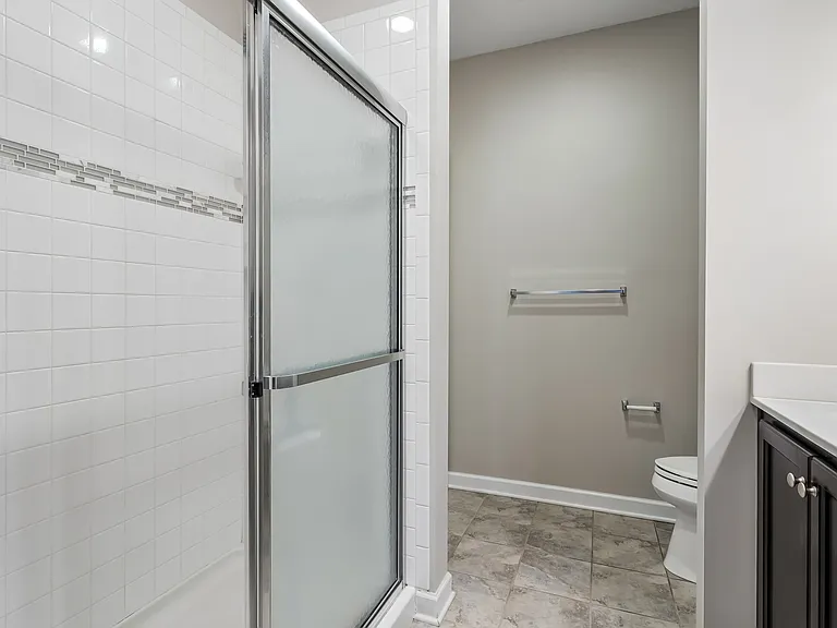 Primary Bathroom shower and separate toilet room