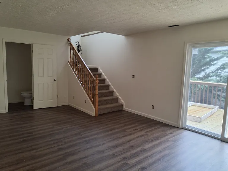 Enjoy the brand new sliding-glass door that opens to your spacious new rear deck, creating the perfect indoor outdoor living experience. Whether you're grilling with friends, morning coffee, or unwinding after a long day.