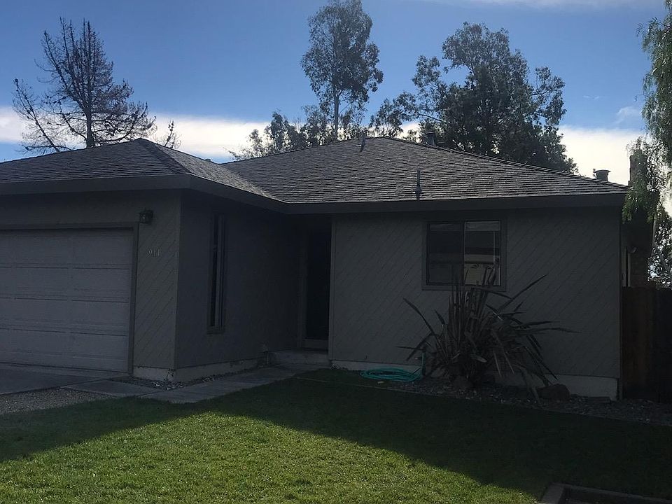 This home has 3 bedrooms and 2 baths, a large two car garage with extra storage. An end unit on a very quiet street.