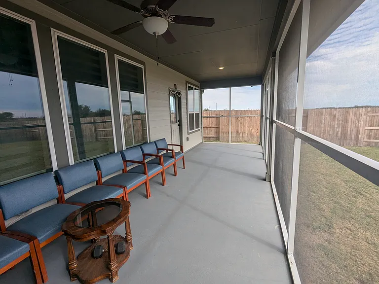 Covered & Screened back patio with painted floor