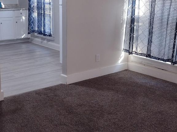Corner of living room looking towards kitchen.