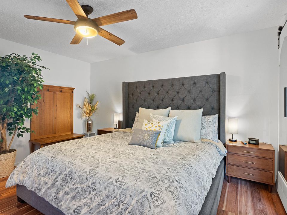 King size bedroom with storage/dresser underneath bed.