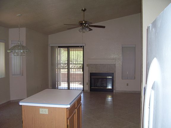 Fireplace in family room off kitchen