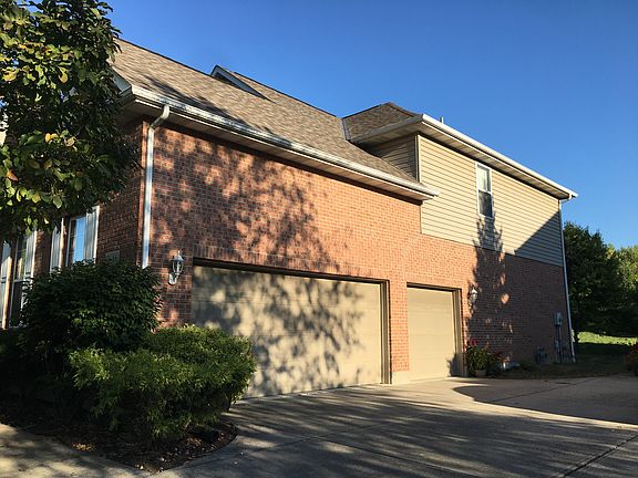 over-sized 3-car garage, side-entrance.