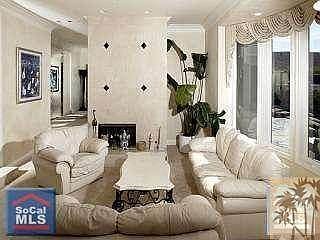 Formal sunken living room with fireplace