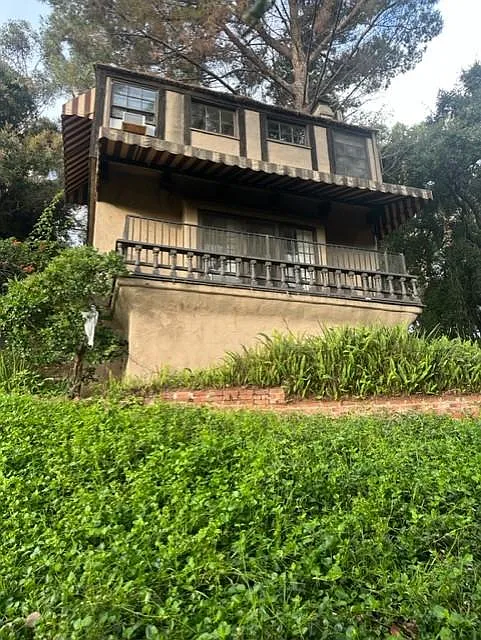 Elegant and charming, two-story townhouse, built in 1928 with English tutor roof with clay tiles.
