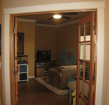 French doors open to this bonus room. Current owner uses it as a play room for the kids, it could ea