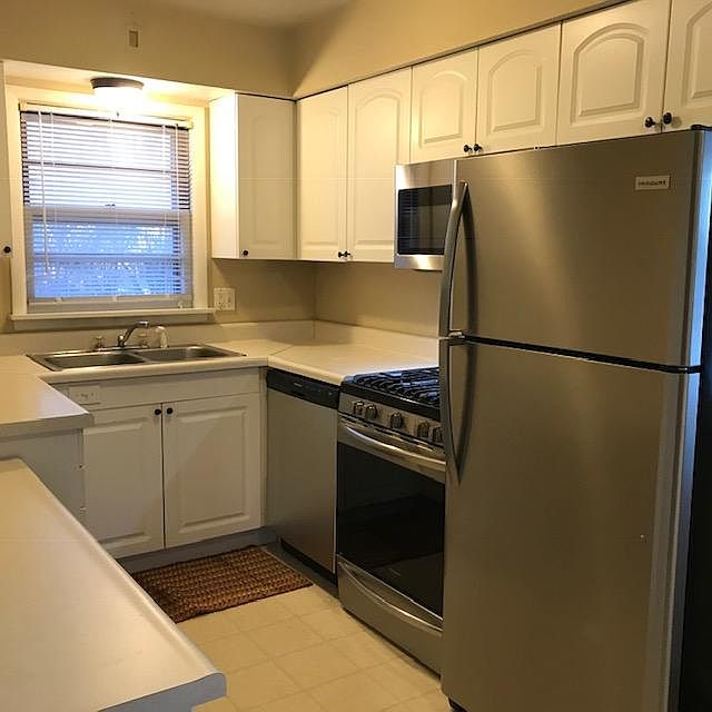 NEW STAINLESS APPLIANCES IN NEW WHITE KITCHEN