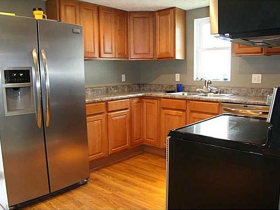 Kitchen. Laminate flooring and tons of cabinets.