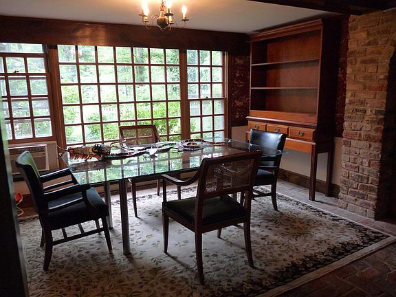 dining room with glass wall looking out to courtyard