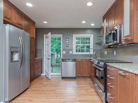 Updated Kitchen with Granite Countertops, SS Appliances & Stunning Cabinets