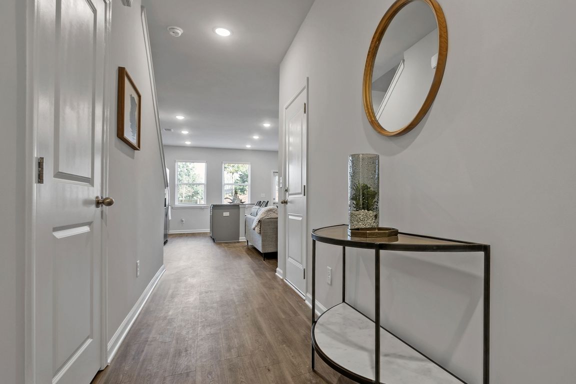 Inviting entryway featuring durable wood-style floors