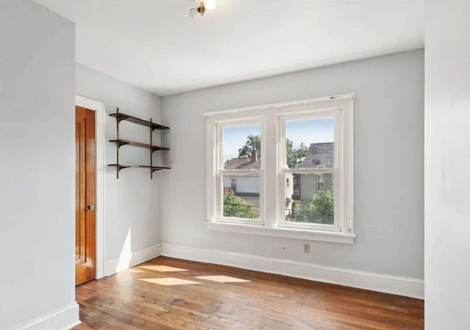Charming two-story home in Cleveland offering three bedrooms and one-and-a-half bathrooms — Photo 3