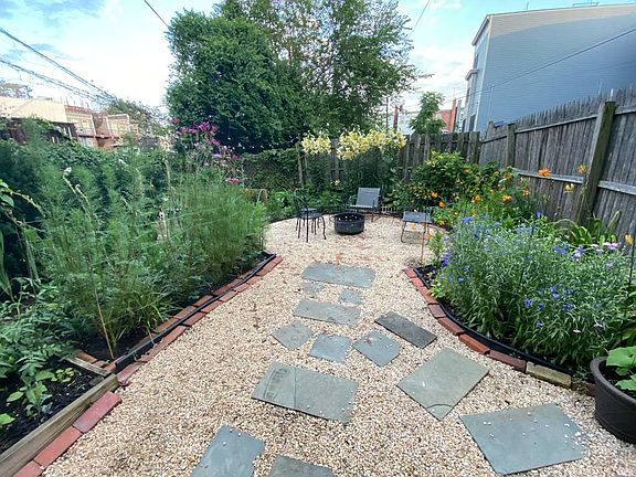 Gorgeous backyard with plenty of room for gardening or taking in the sun. Furniture is included.