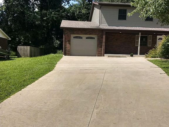 ONE CAR GARAGE WITH EXTRA PARKING IN THE DRIVEWAY. OPEN FRONT PORCH