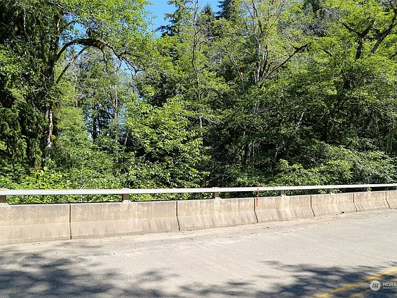 On Map - Point E.  This is property line corner area along the road/bridge.  the middle of the creek is the corner of the proeprty to the south. Points are estmated on Pictures. Stakes are present to show points and lines.>