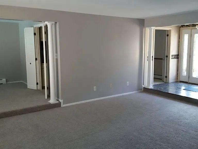 View of dining room, entry to kitchen, living room, entry foyer, entry to kitchen and opposite of kitchen/foyer, (not seen) hallway to front bedroom, hallway to full bathroom, a 2nd bedroom and hallway to master bedroom. Behind this shot 2nd entry MB.