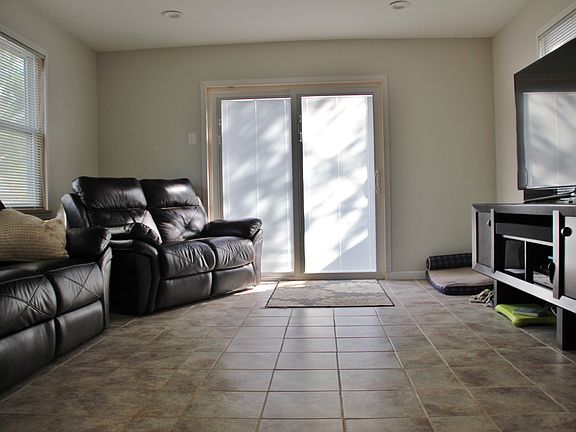 Addition off the back of the house with sliders leading to t