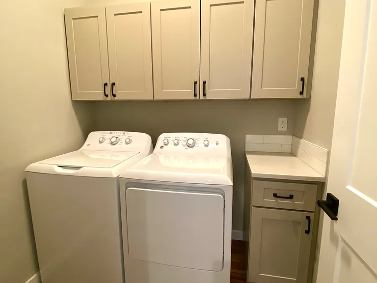 Side by side washer/ dryer on main floor. Easy access from bedrooms to laundry!