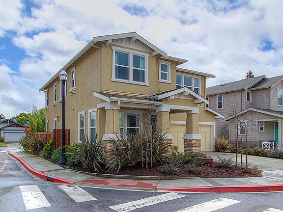 Premium lot on a corner with two car garage.  The garage is Finished with built-in, Shelving for extra storage.  extra parking behind this home. Custom redwood gate for easy access