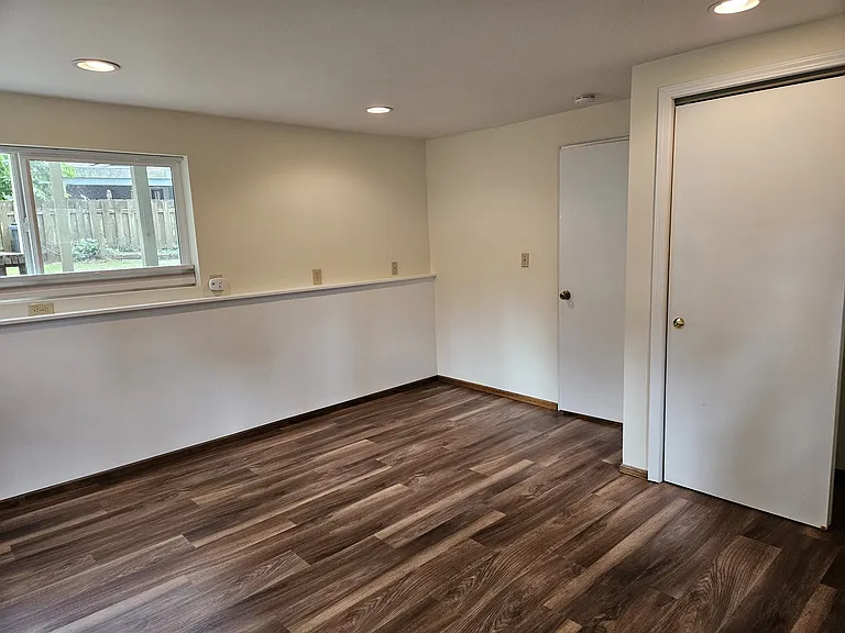 basement bedroom looking SW, showing closet and door to laundry room