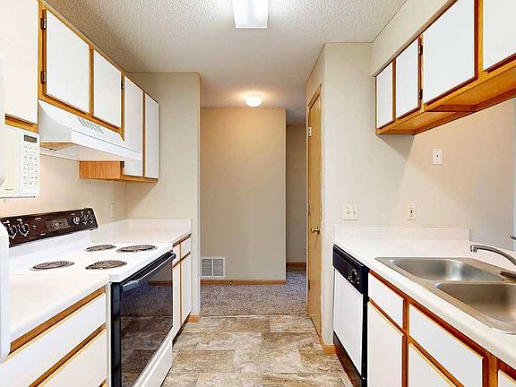 Efficient galley kitchens keep everything within easy reach to make meal prep and cleanup flow smoothly.