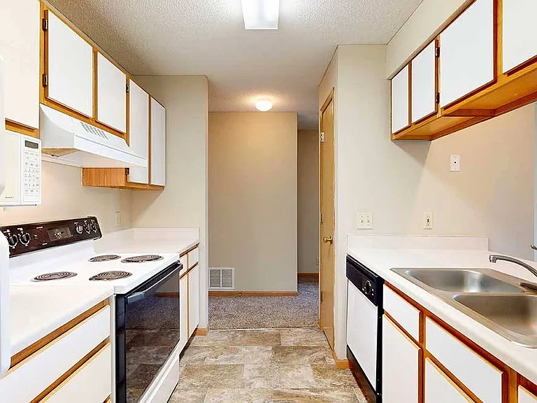 Efficient galley kitchens keep everything within easy reach to make meal prep and cleanup flow smoothly.