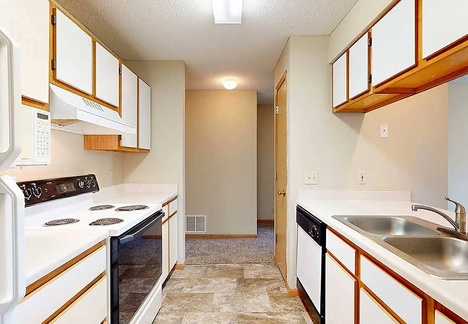 Efficient galley kitchens keep everything within easy reach to make meal prep and cleanup flow smoothly.