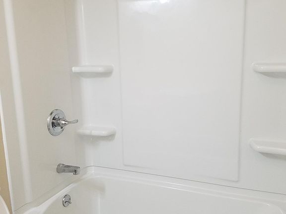 Newly installed bathtub and faucet