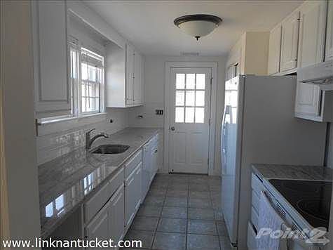 Kitchen with Door to Bluestone Patio