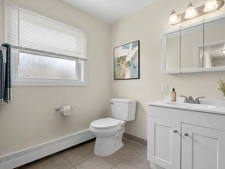 Step into the modern charm of Patchogue Village at Rider, an Eagle Rock Community. This pristine bathroom features sleek fixtures and ample natural light, creating a serene retreat. Elevate your lifestyleschedule a tour today!