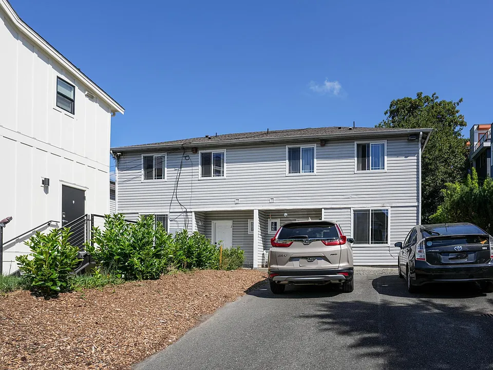 Townhouse #2 (left), townhouse #3 (right), and parking spots viewed from East Spruce Street