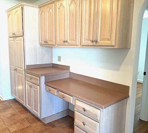 KITCHEN WITH BUILT IN PANTRY AND DESK AREA