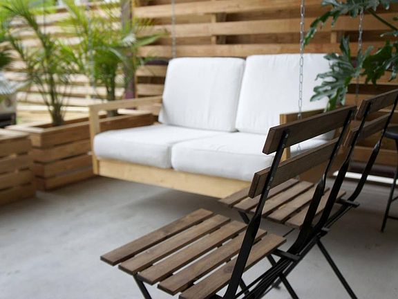 Porch adjacent to your unit with swing