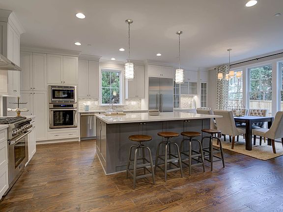 Cabinetry runs wall to wall, then opens wide